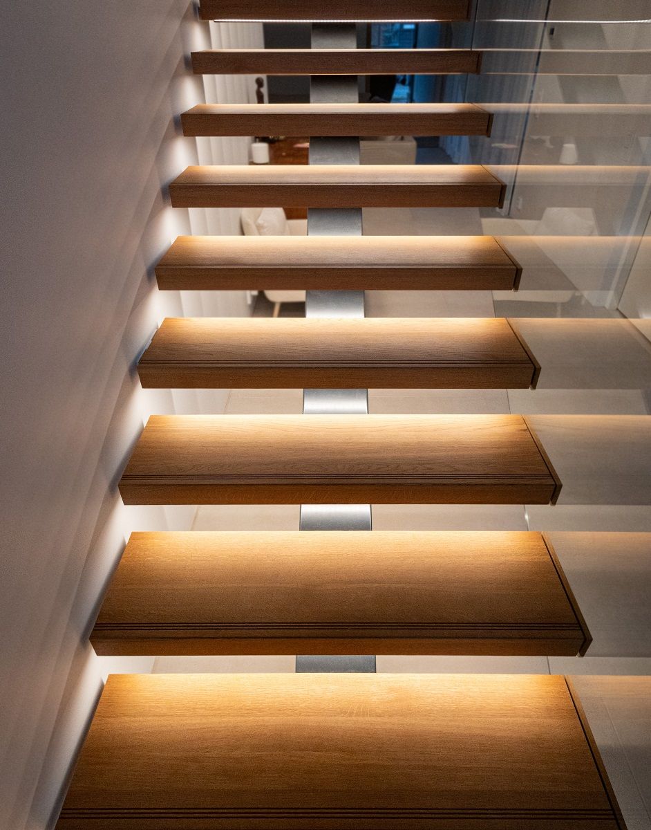 The solid stair treads have indirect LED strip lighting, which illuminates each step separately.